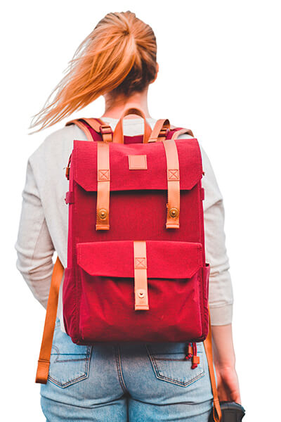 girl facing backward wearing red backpack